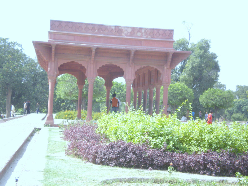 Red sandstone pavilion in garden
