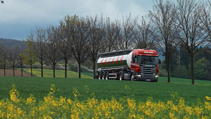 Red Scania truck in a field