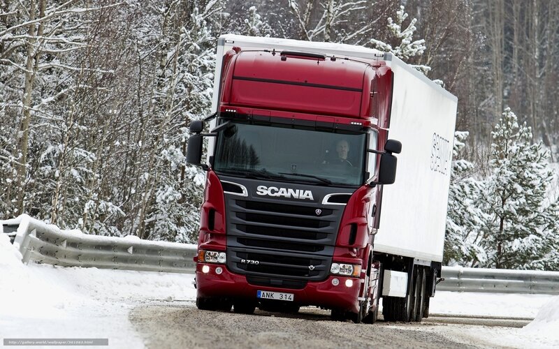 Red Scania truck on snowy road