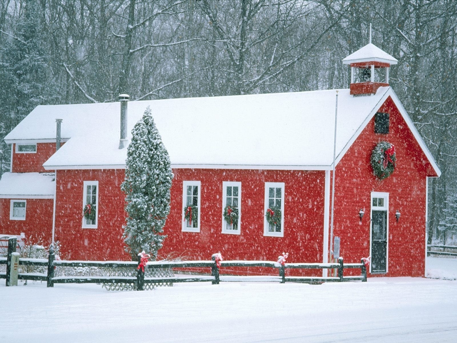 Red schoolhouse in winter
