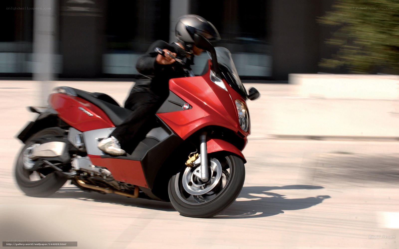 Red scooter in motion