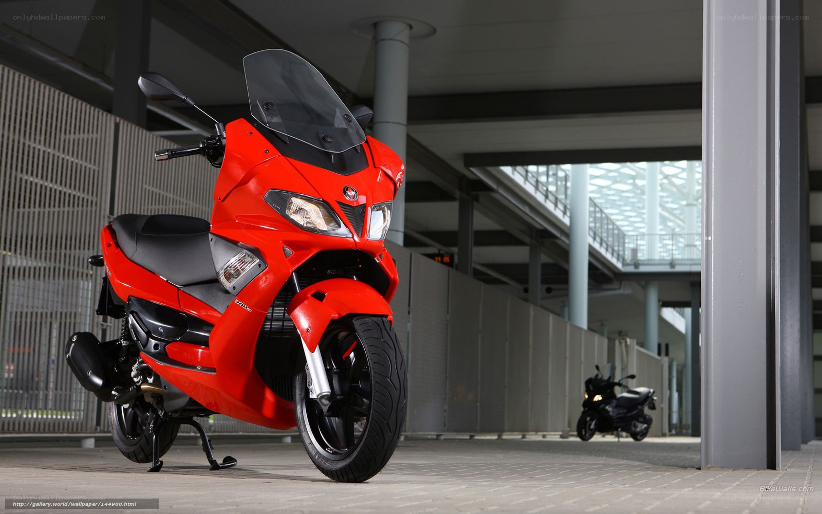 Red scooter in parking garage