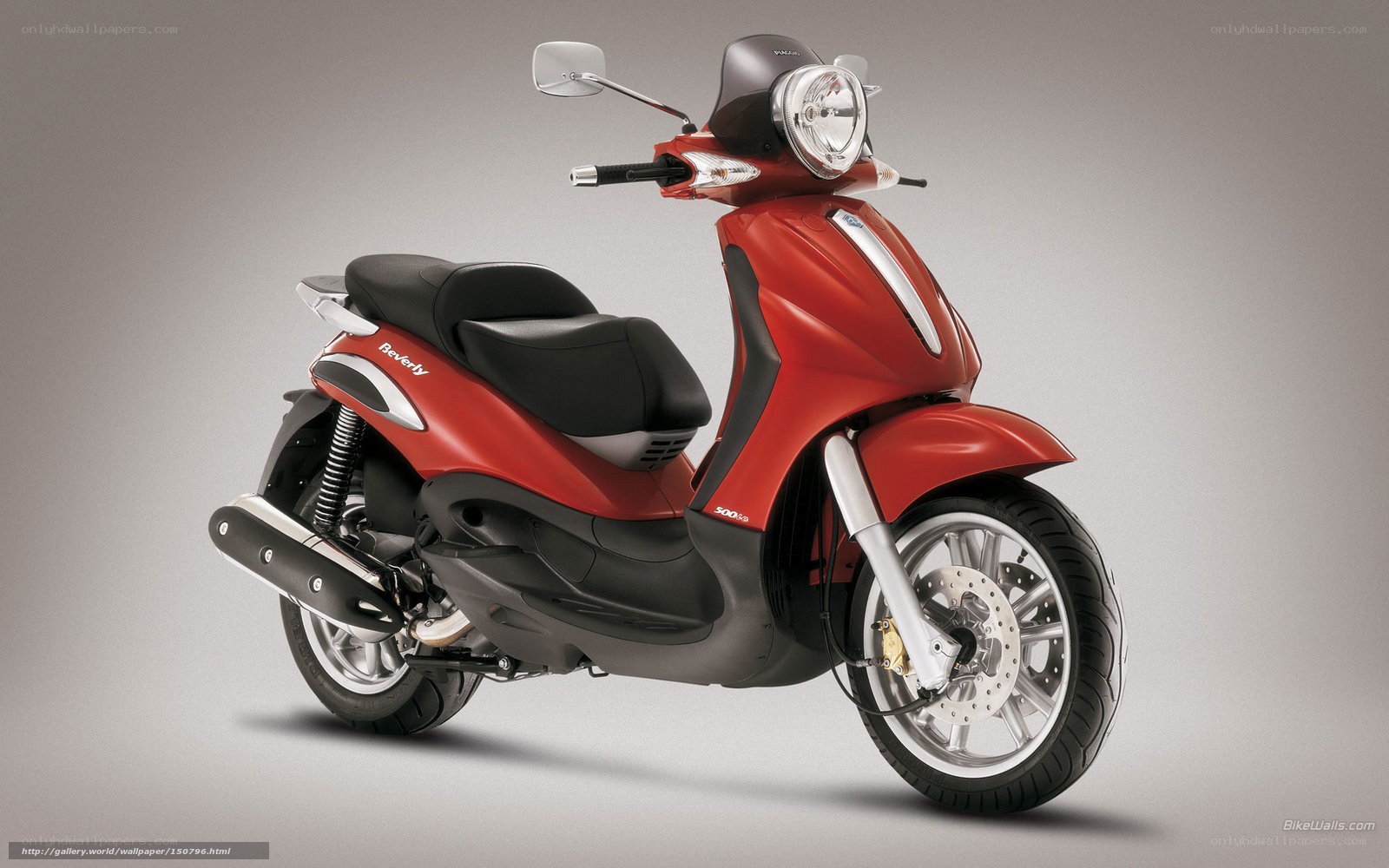 Red scooter in studio