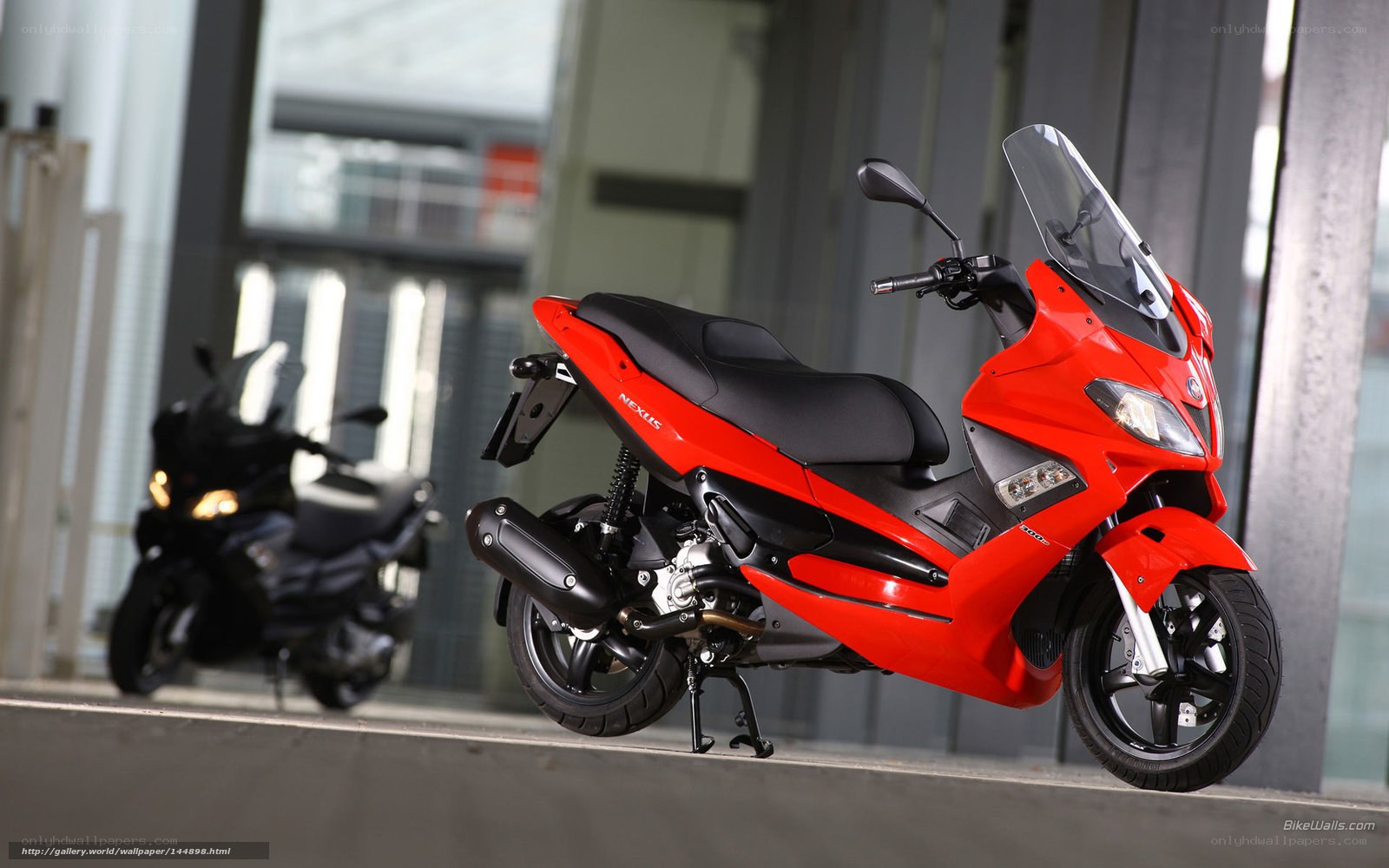Red scooter in urban setting