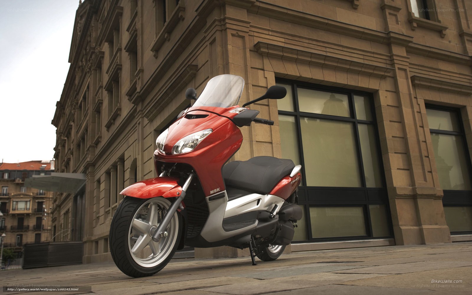 Red scooter on city street