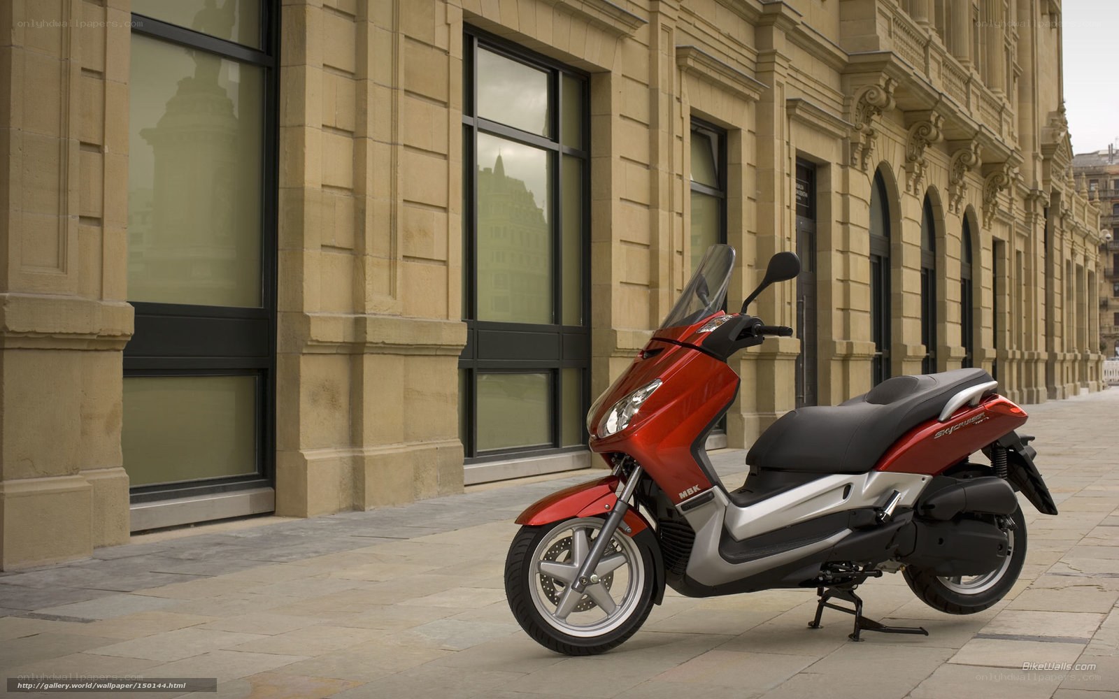 Red scooter on city street
