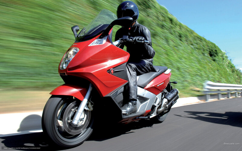 red scooter on road