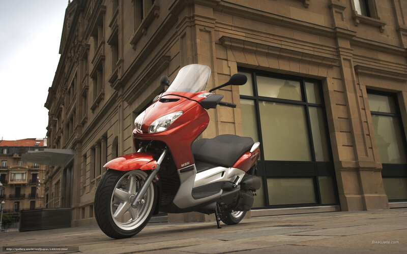 Red Scooter on Sidewalk — Urban