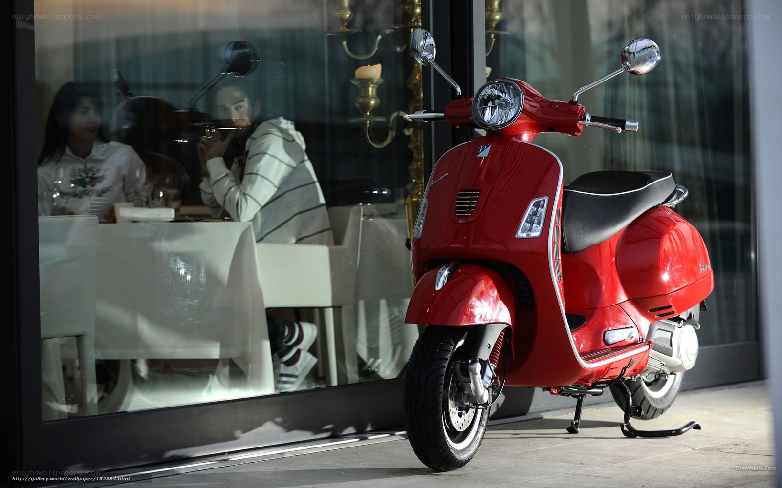 Red scooter outside restaurant