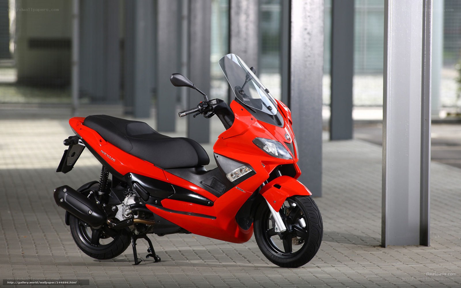 Red scooter parked outside