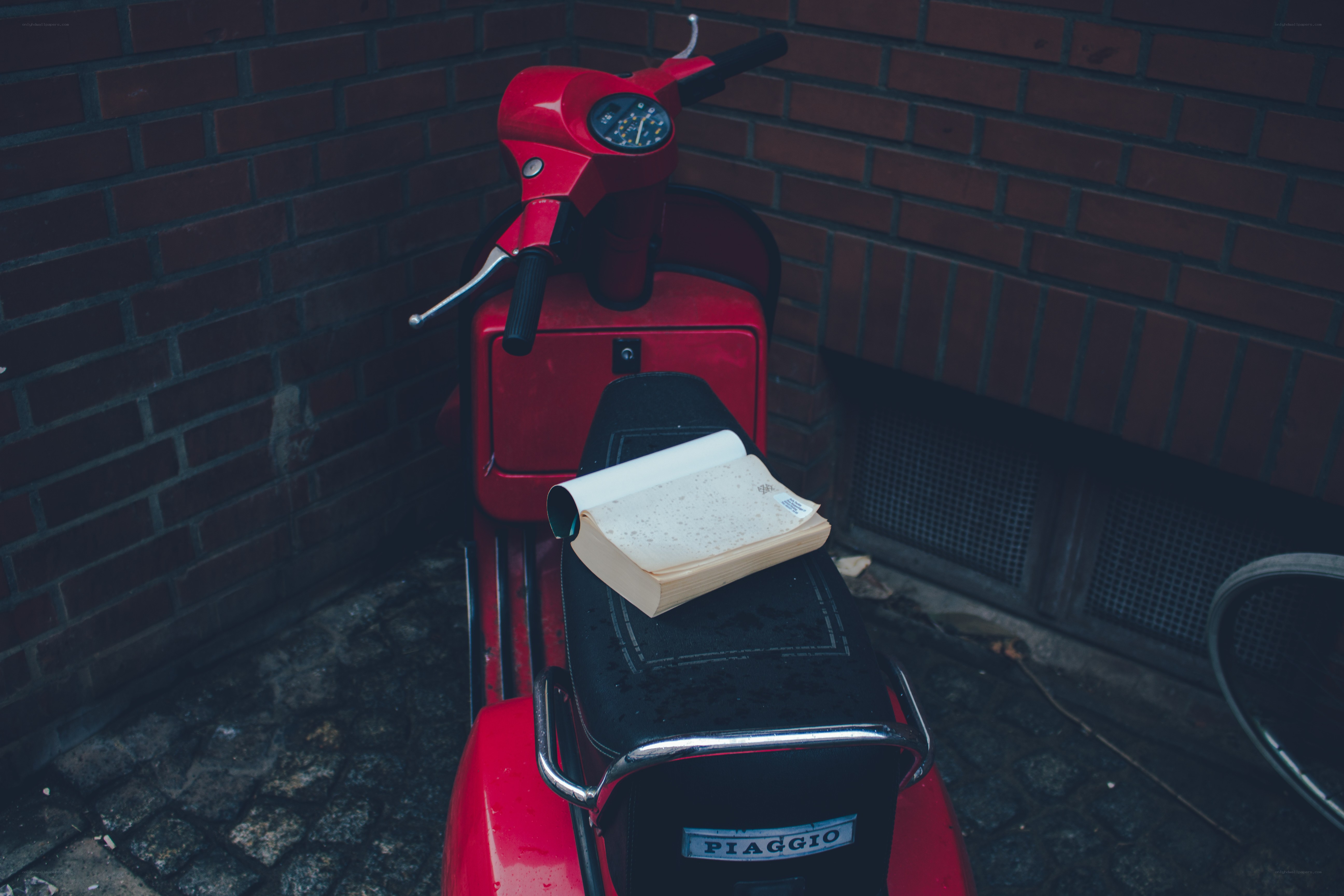 Red scooter with book