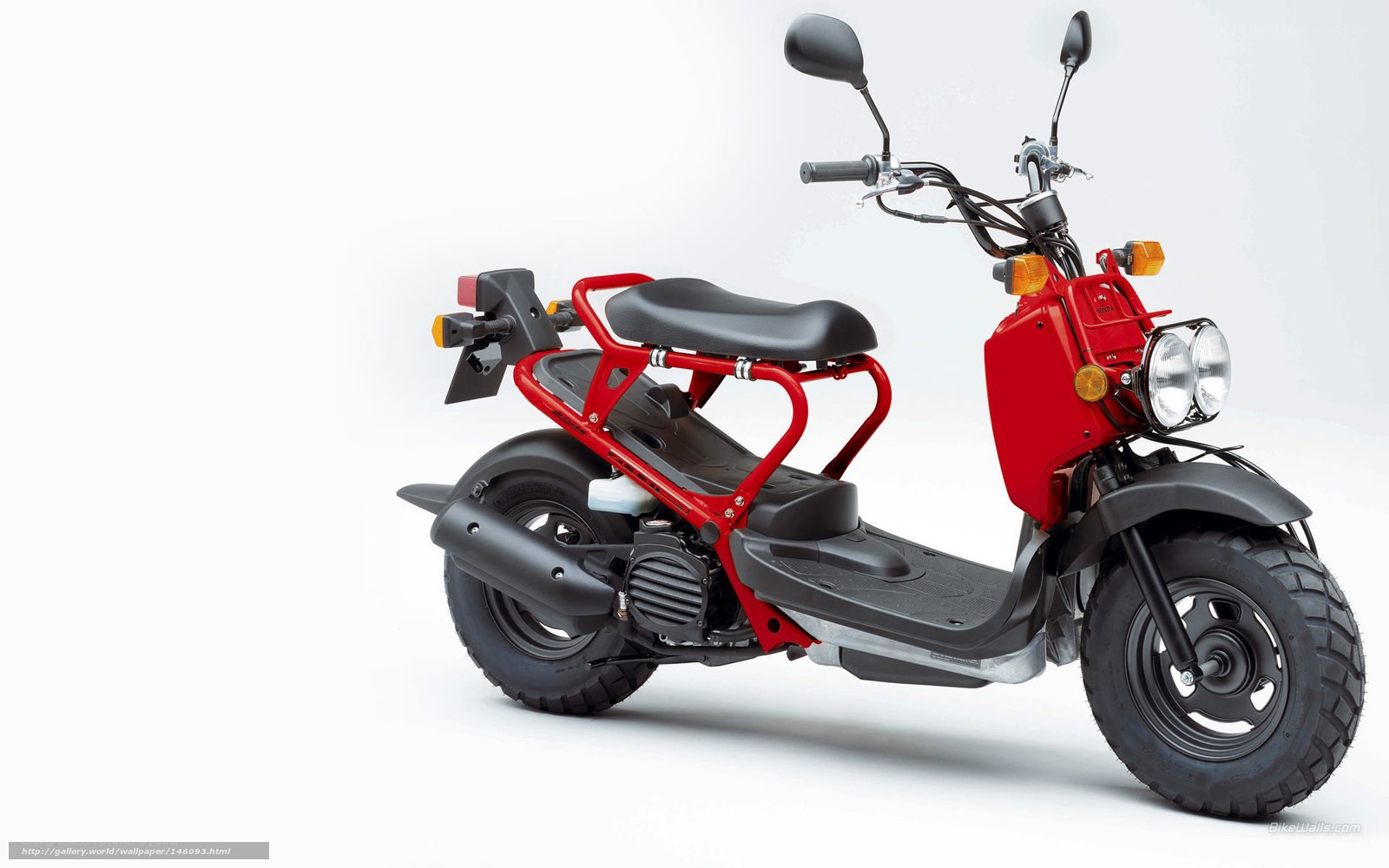 Red scooter with passenger rack