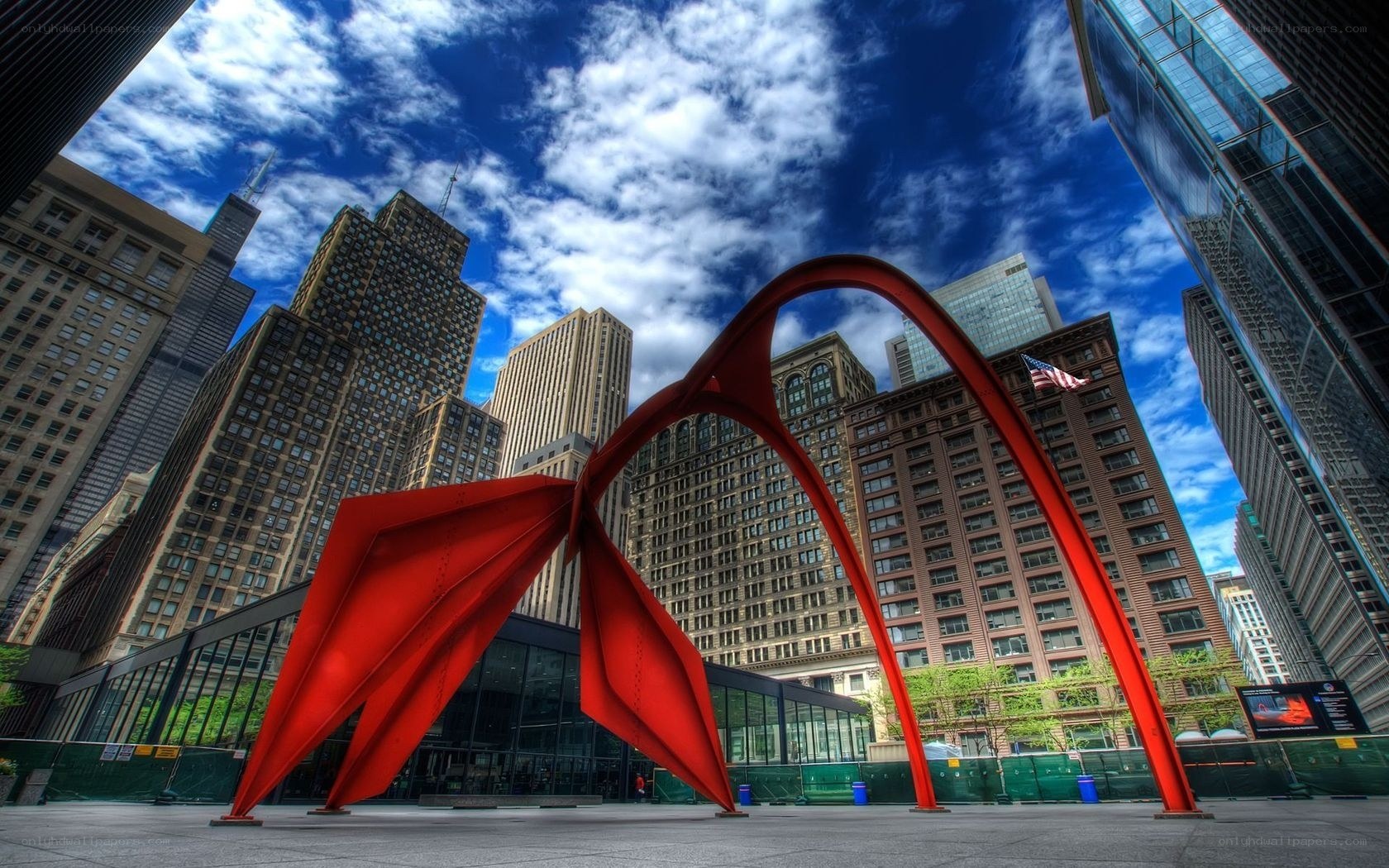Red sculpture in city plaza