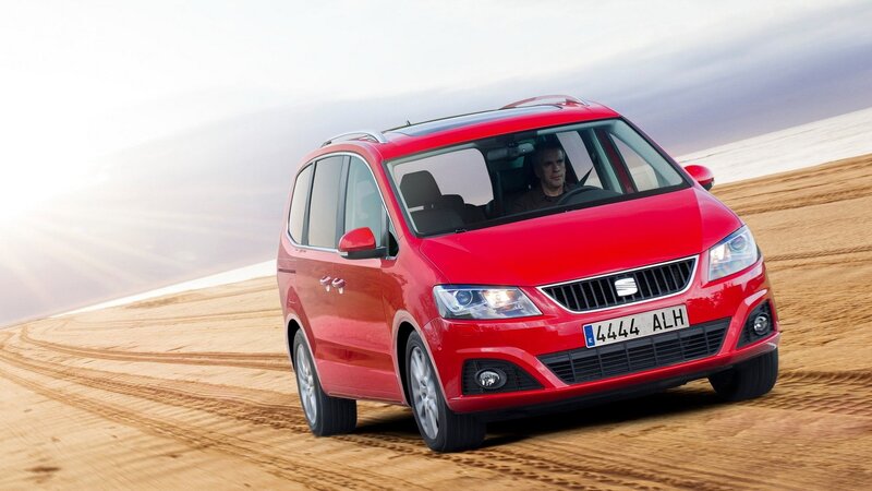 Red SEAT Alhambra driving on sand