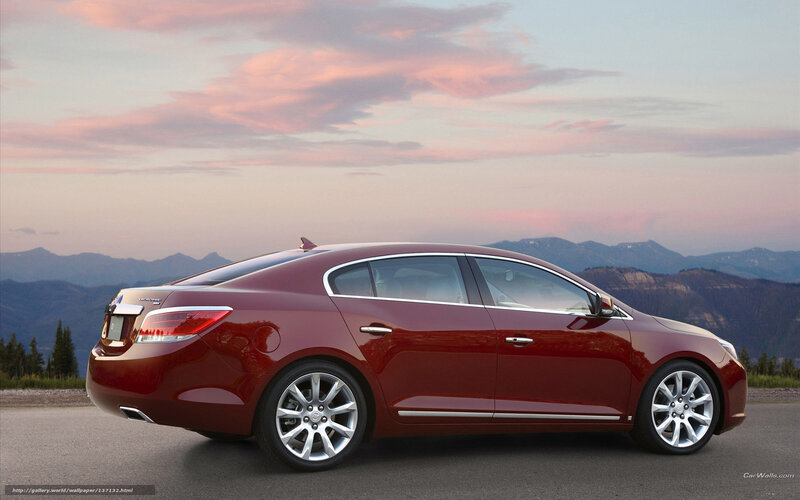 Red sedan at sunset