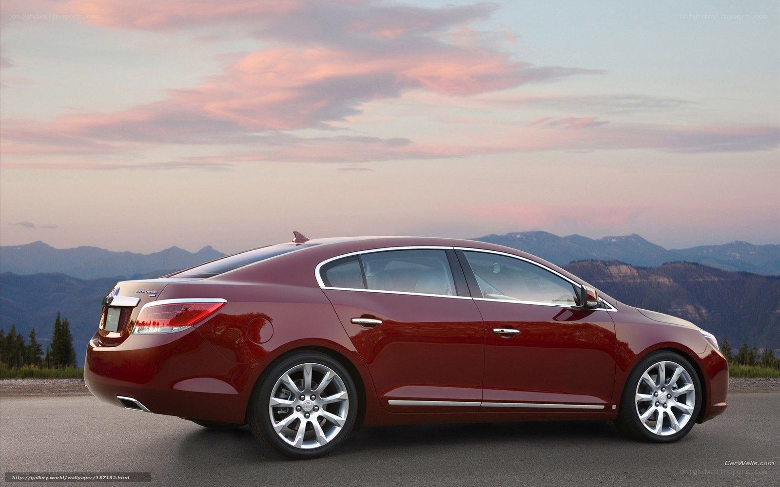 Red sedan at sunset