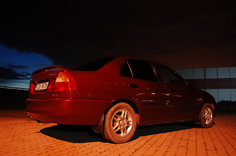 Red Sedan Car — Dramatic, Night