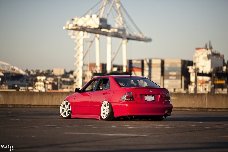 Red Sedan Car — Dramatic, Sunset, Photograph, Crane