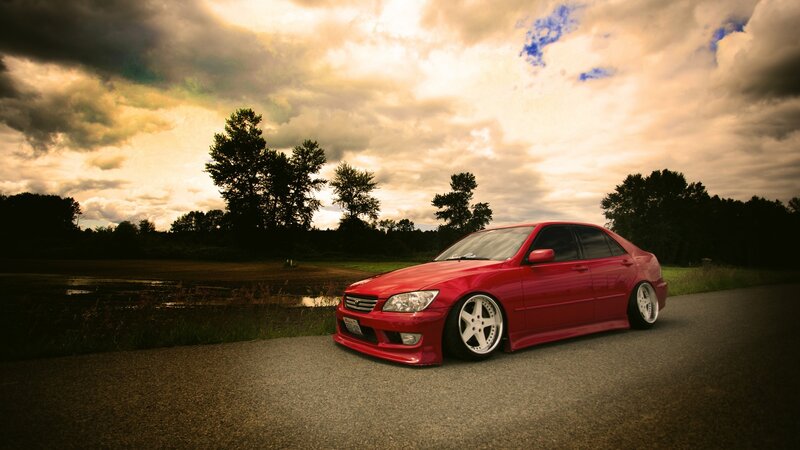 Red Sedan Car — Dramatic, Sunset, Photograph, Road