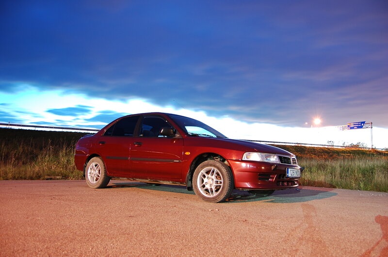 Red Sedan Car — Dramatic