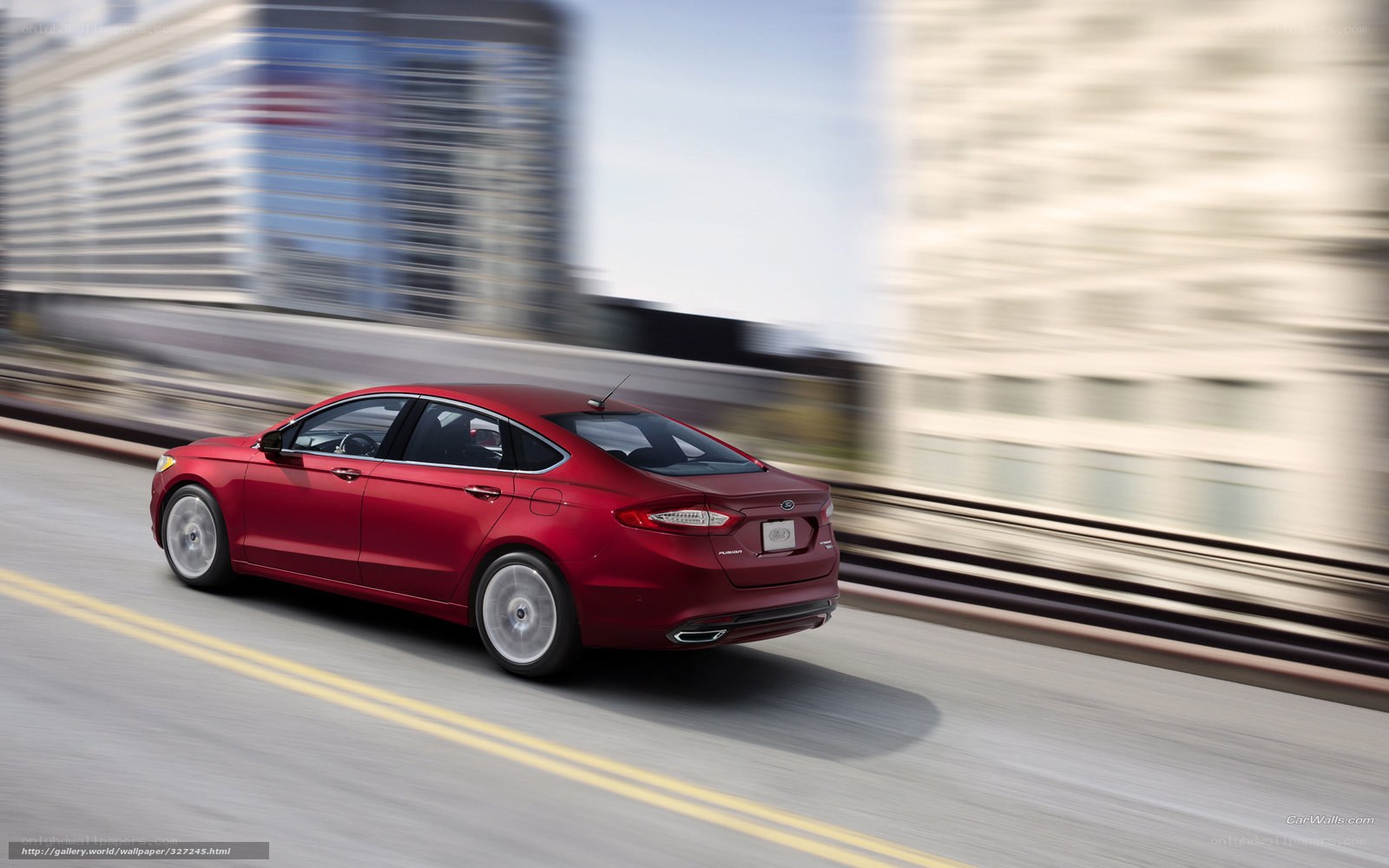Red sedan in city motion