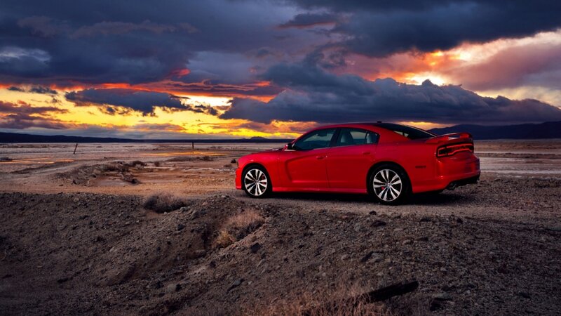 Red Sedan in Desert — Dramatic