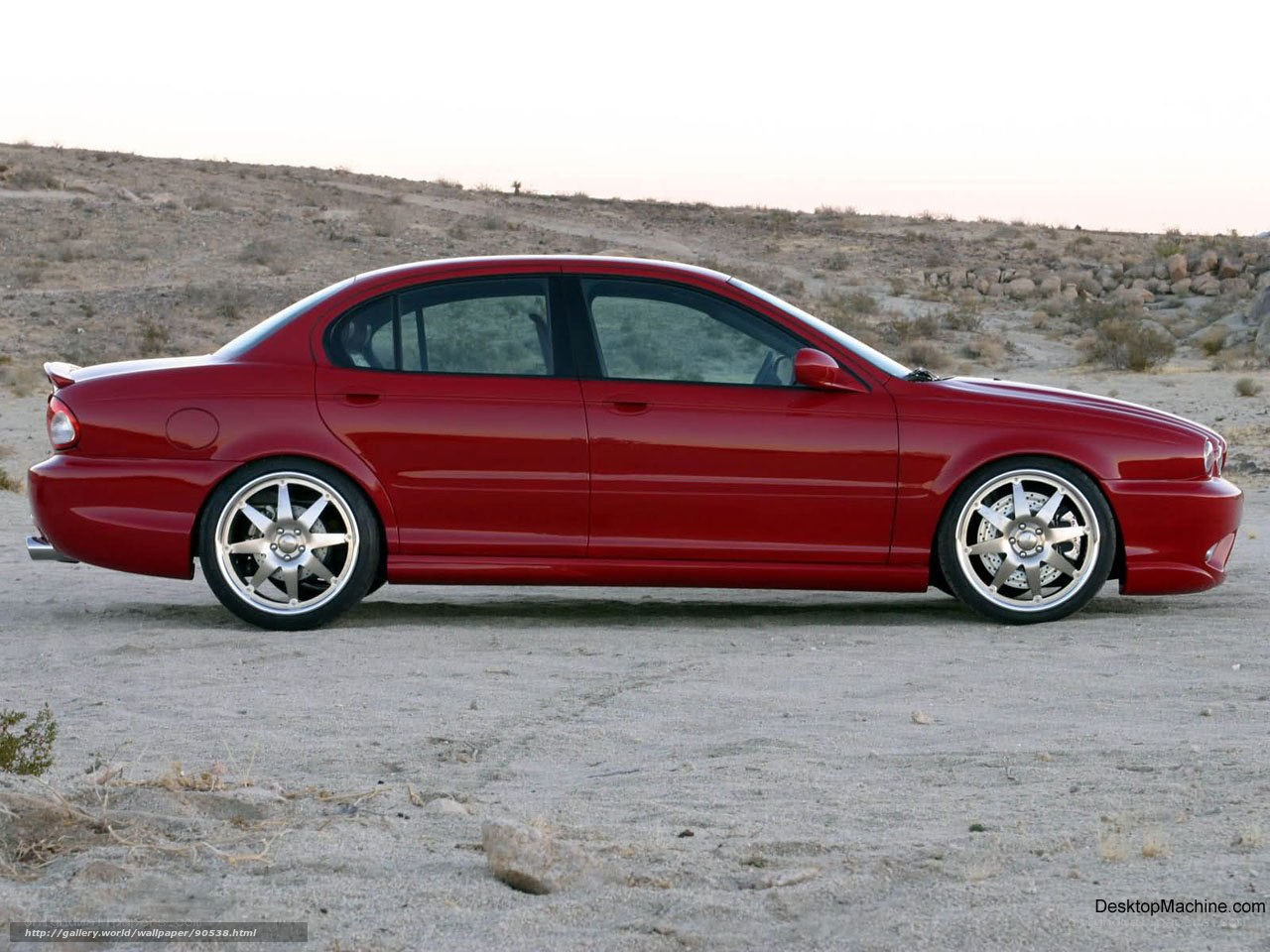 Red sedan in desert