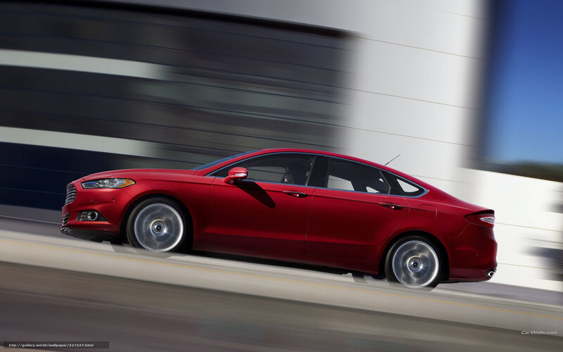 Red sedan in motion