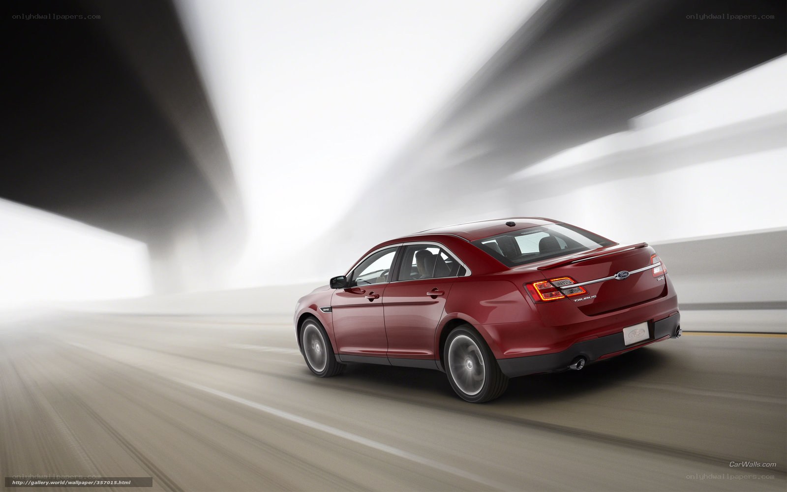 Red sedan in motion