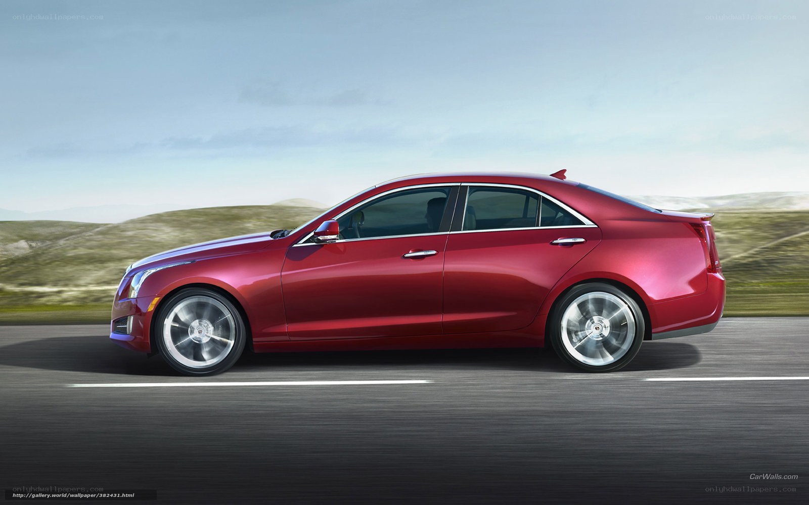Red sedan in motion