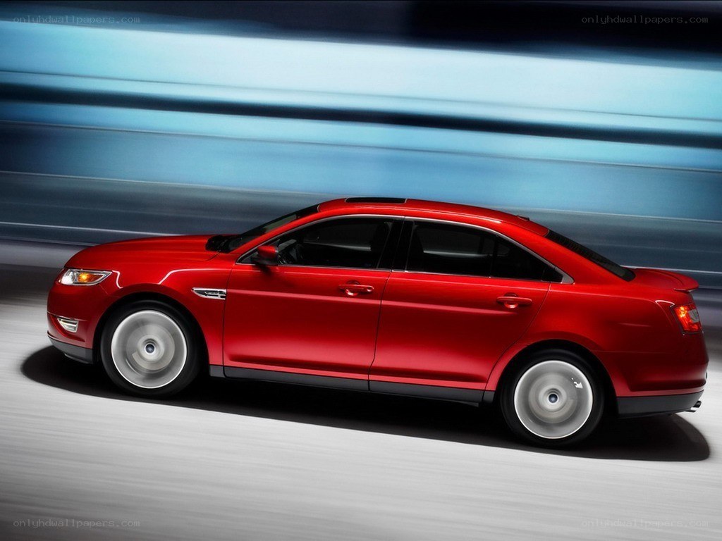 Red sedan in motion
