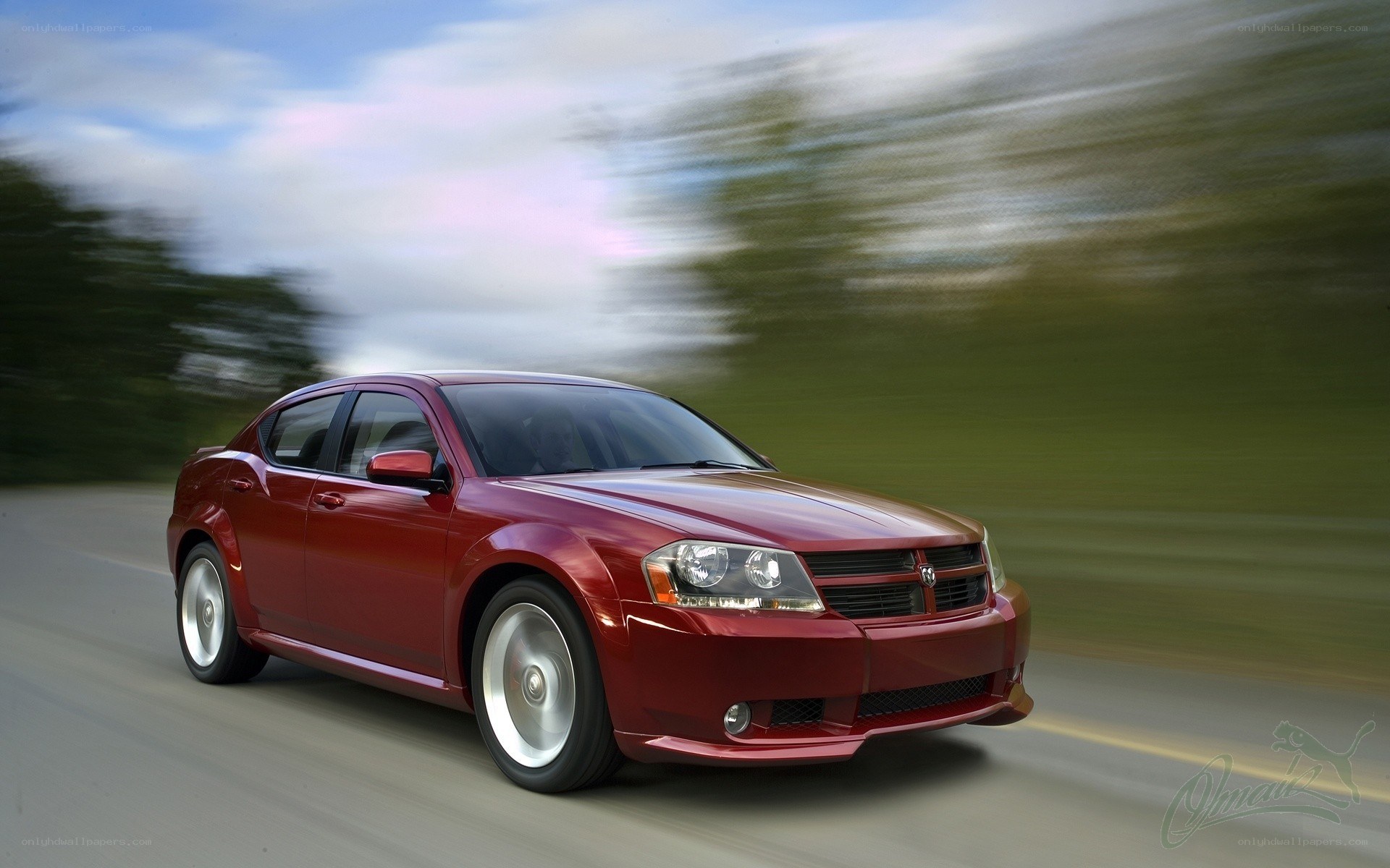 red sedan in motion