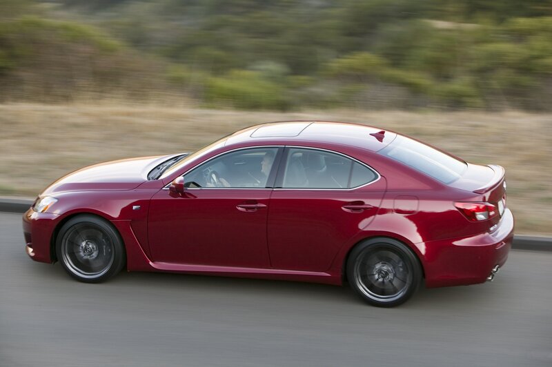 Red sedan in motion
