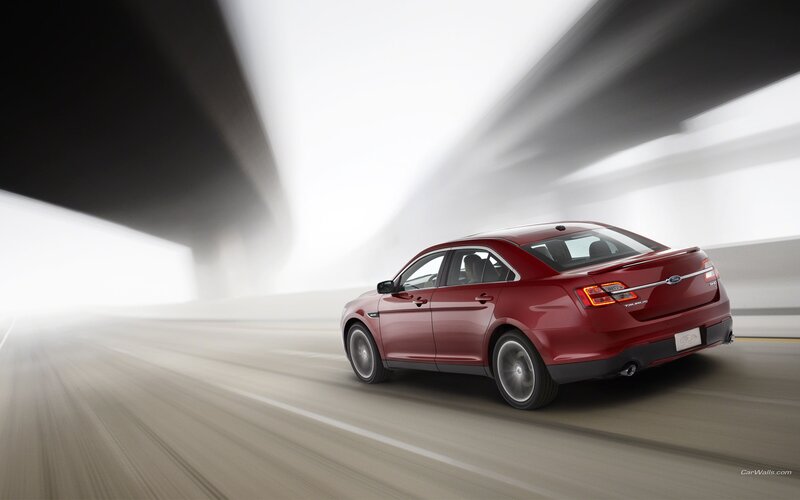 Red sedan in motion