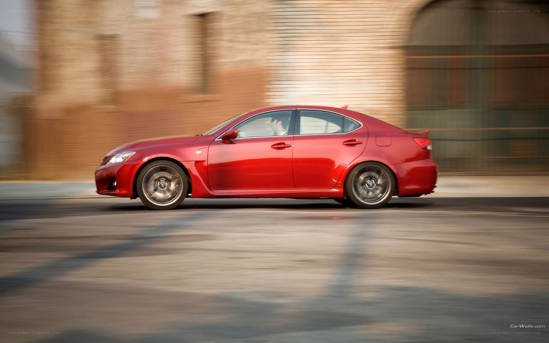 red sedan in motion
