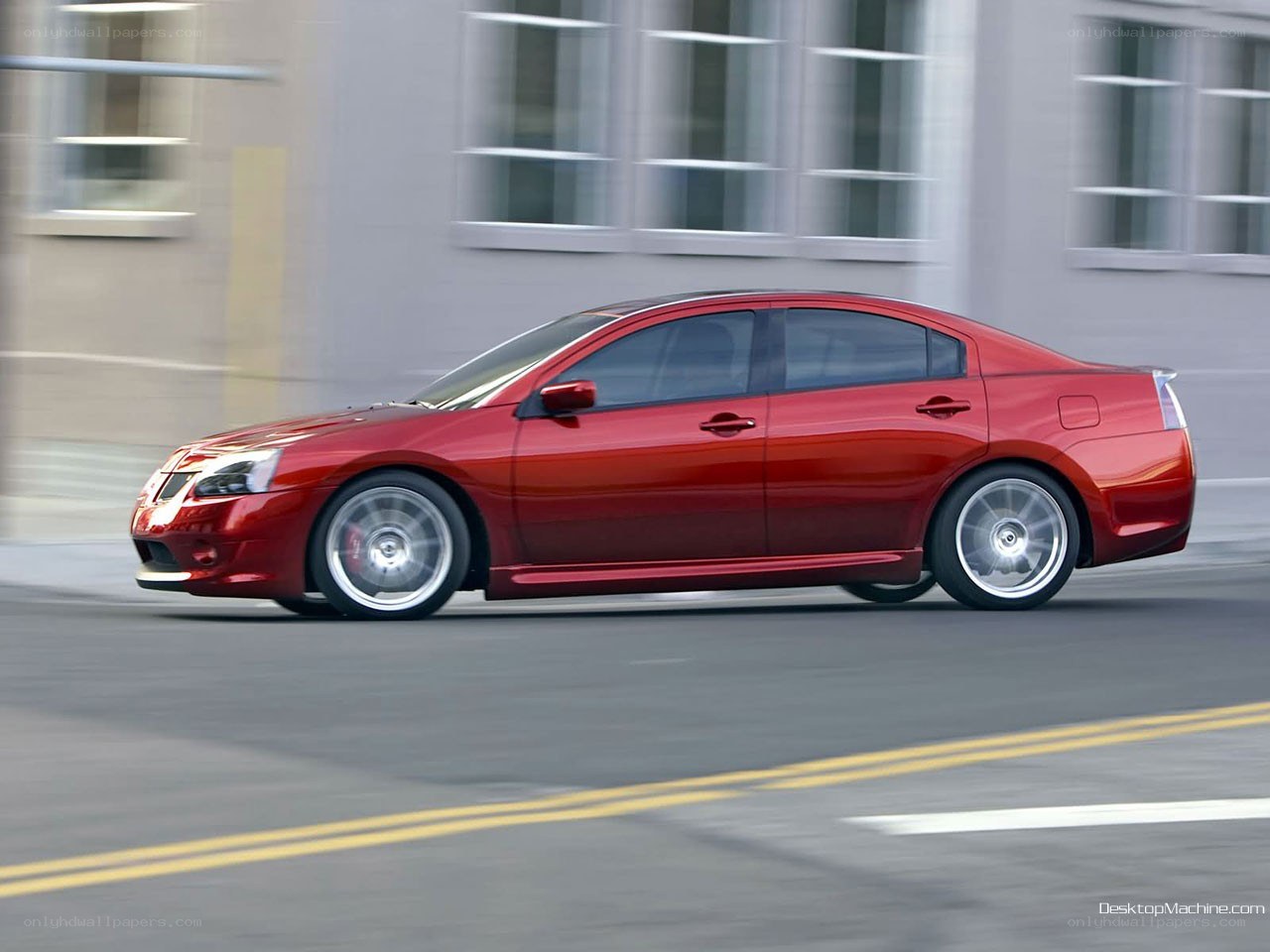 red sedan in motion