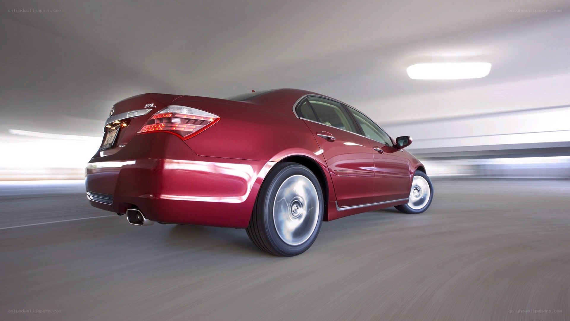 red sedan in motion
