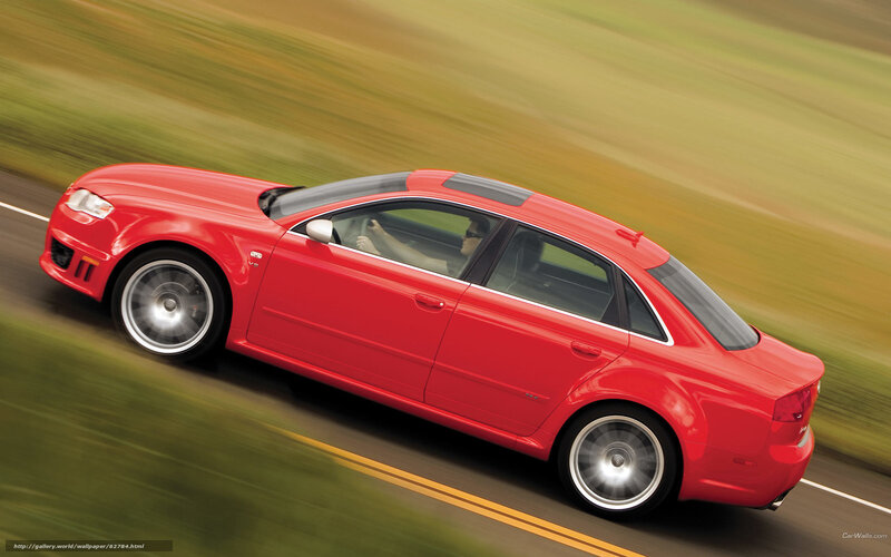 red sedan in motion