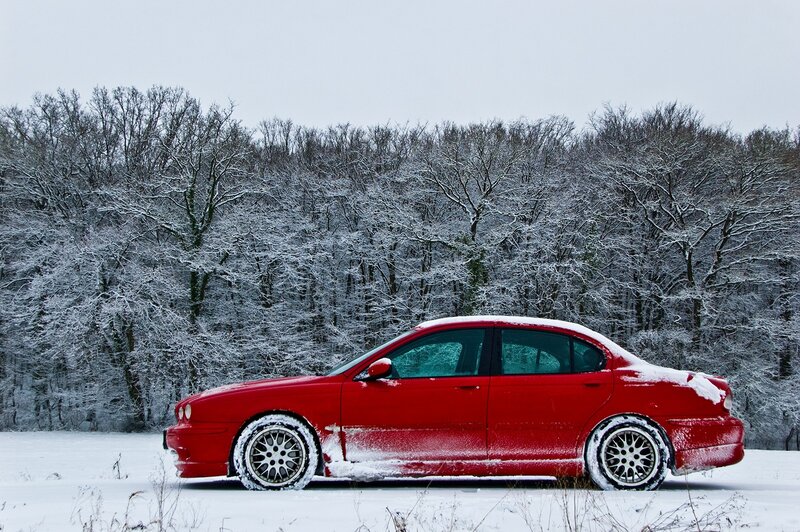 Red Sedan in Snow