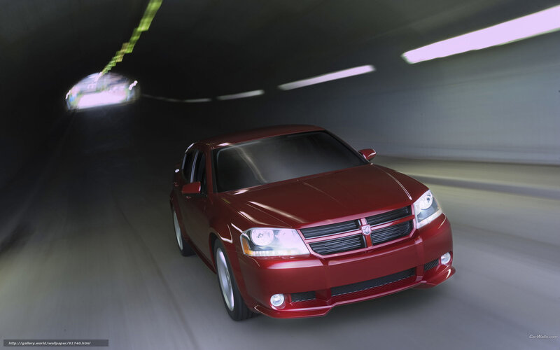 Red sedan in tunnel