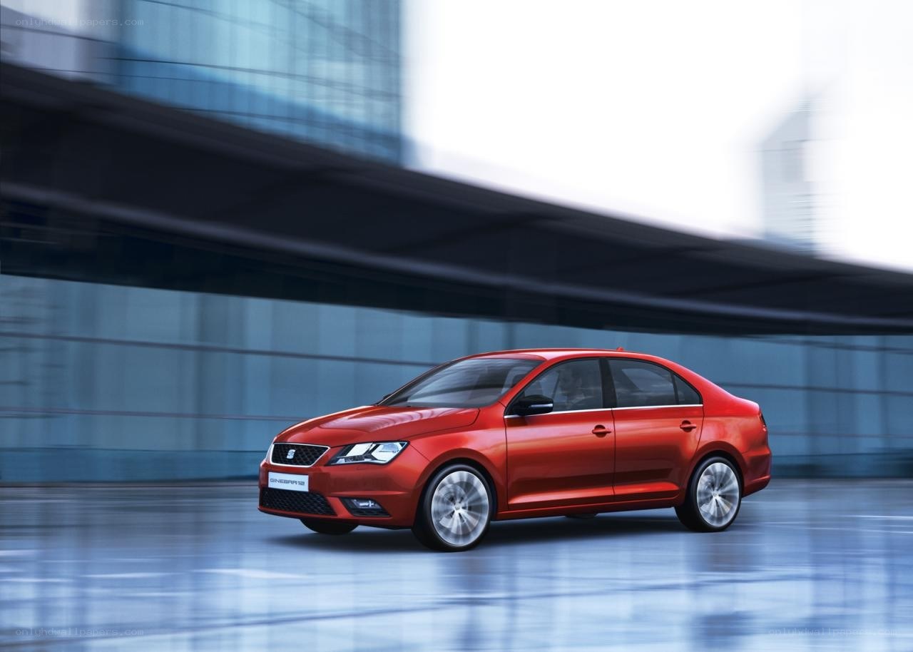 Red sedan in urban setting