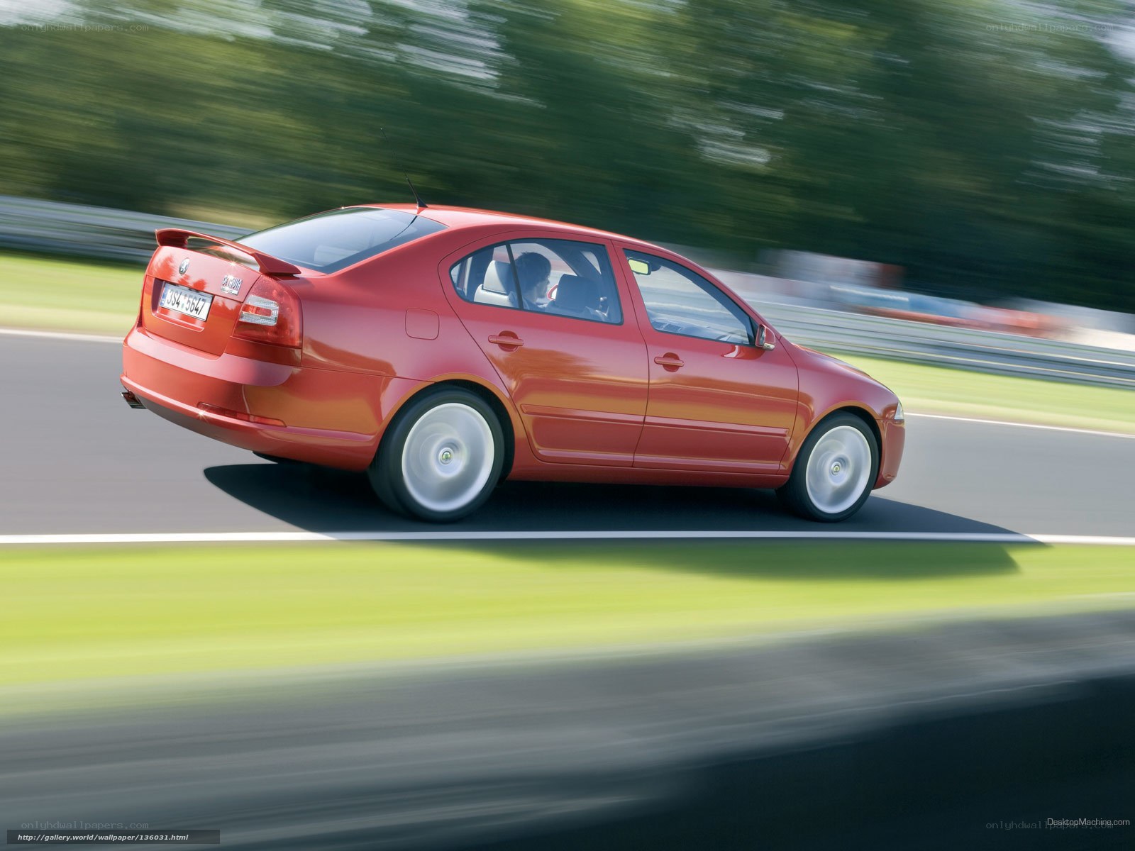 red sedan on a racetrack