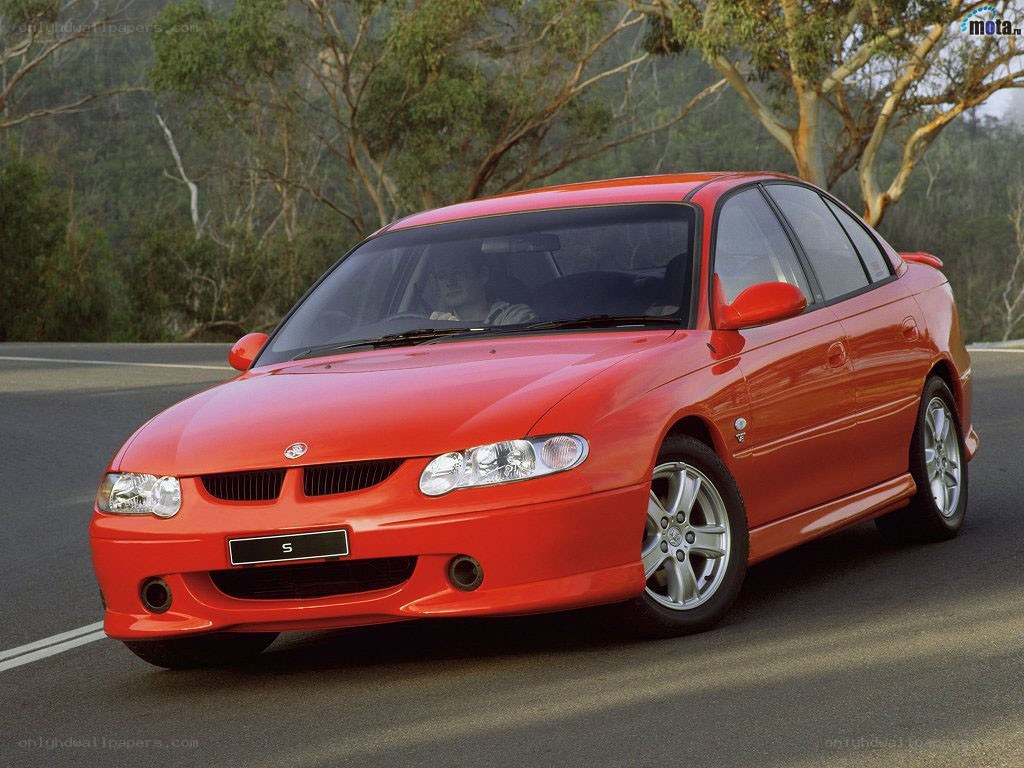 red sedan on a road