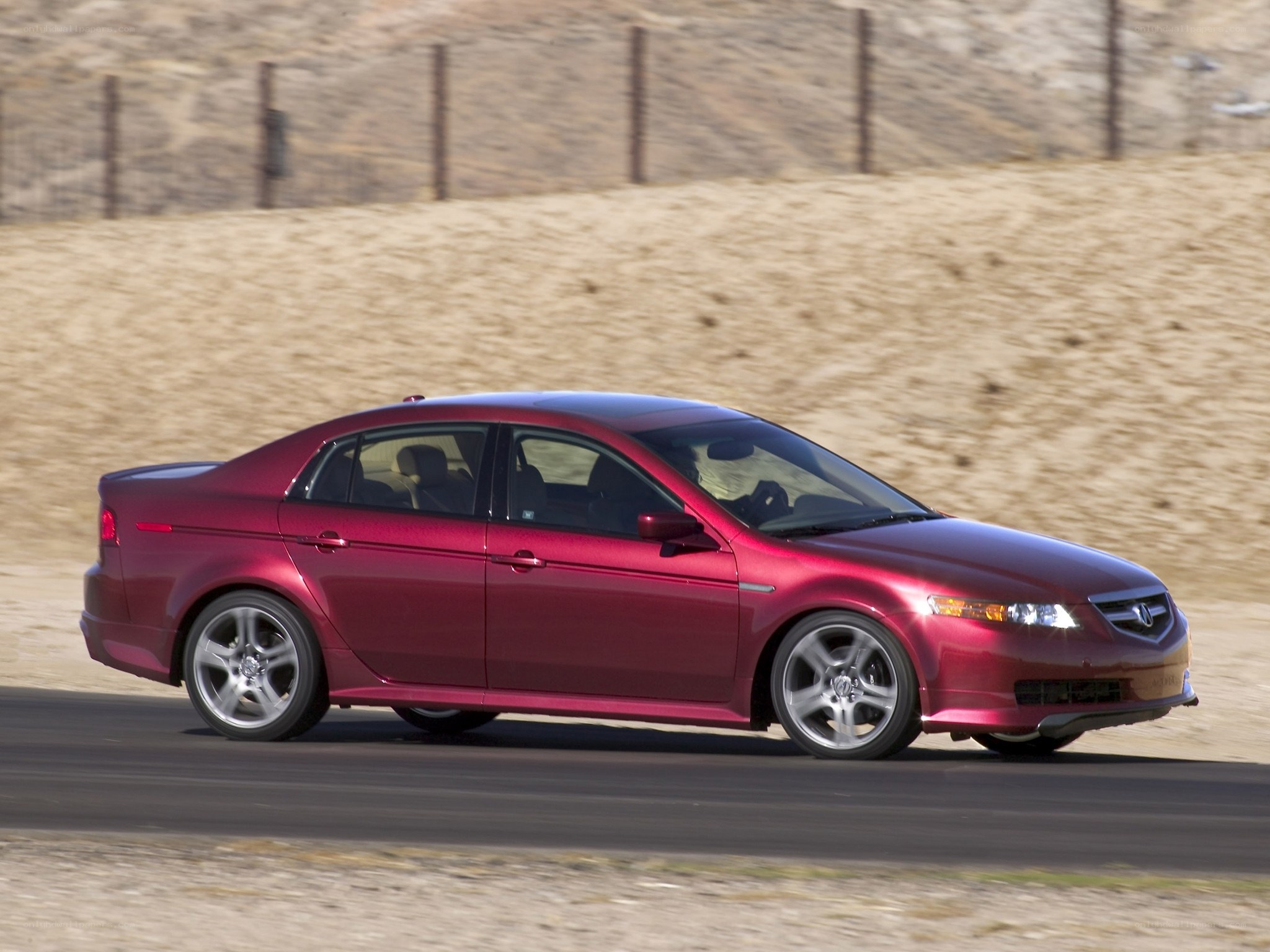 red sedan on a road