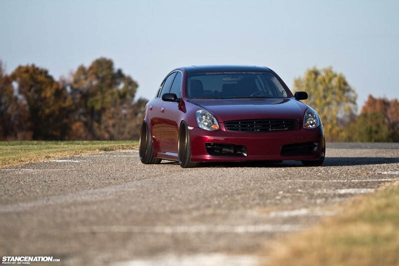 Red sedan on a track