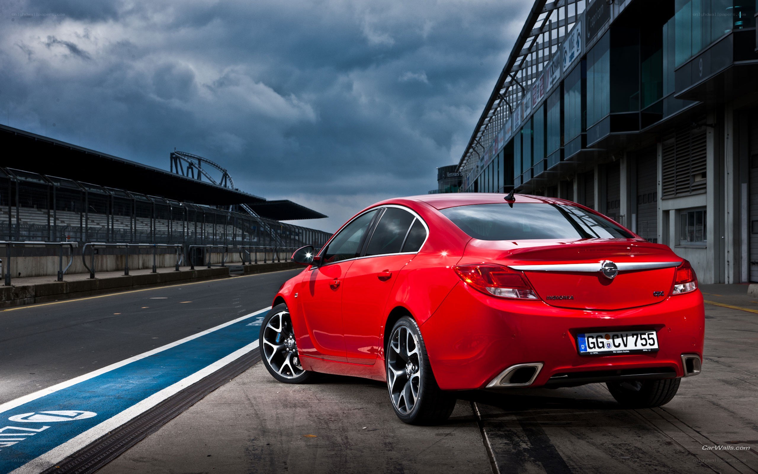 Red sedan on racetrack