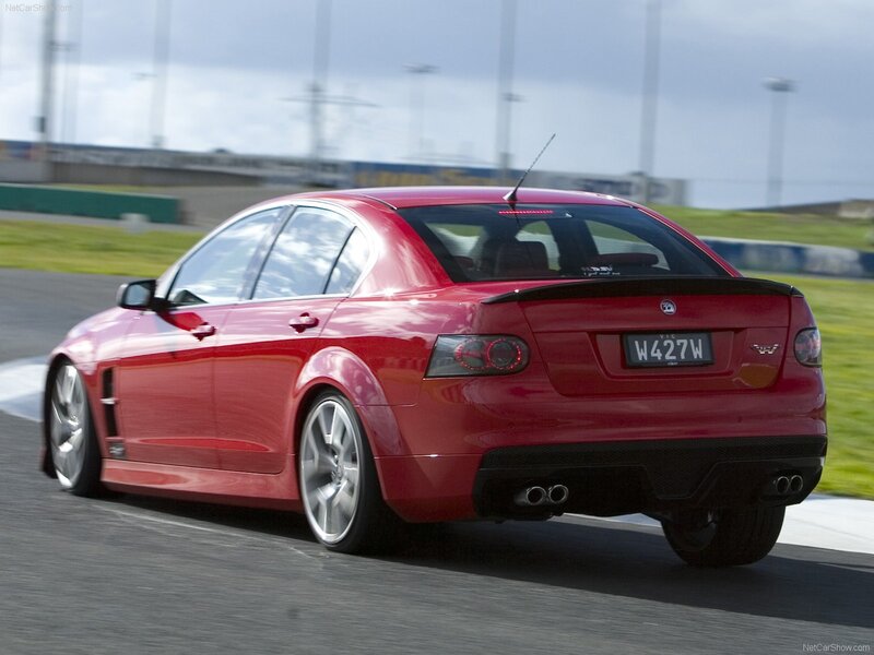 red sedan on racetrack