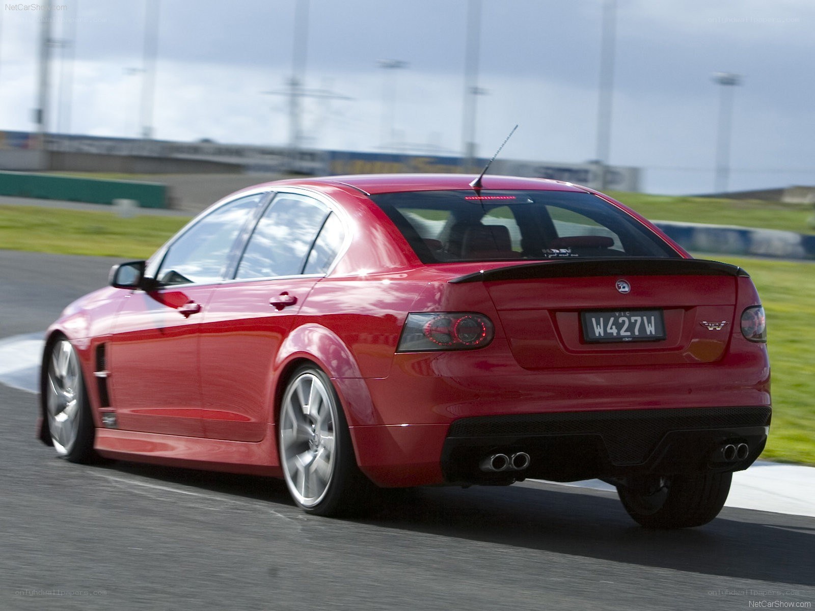 red sedan on racetrack