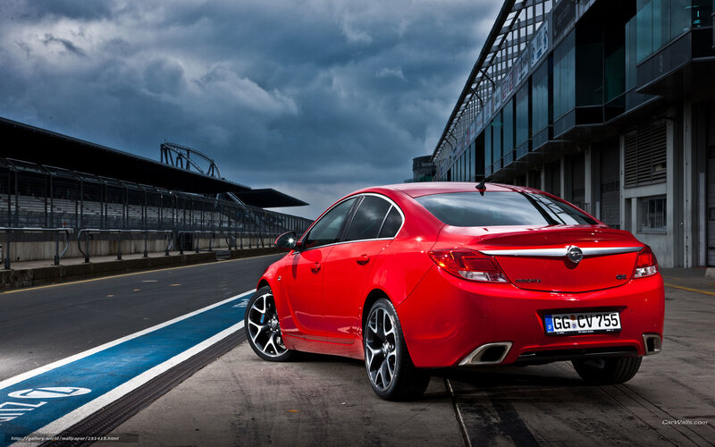 Red sedan on racetrack