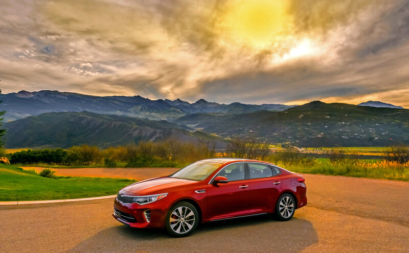 Red Sedan on Road — Dramatic, Sunset
